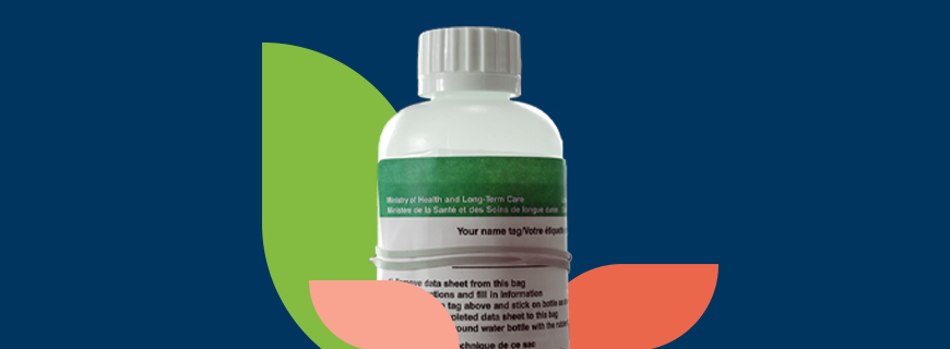 Well water sampling bottle on a decorative background.