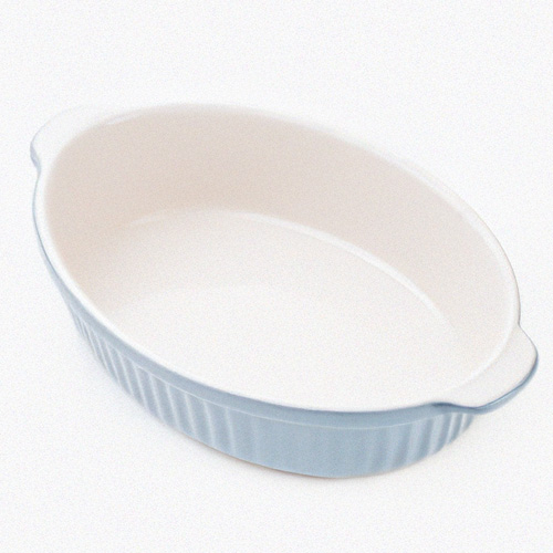 Food skills 7 Empty blue ceramic oval baking dish on a white background